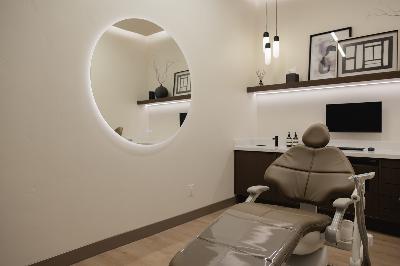 A treatment room at Form + Function, with a backlit mirror instead of an overhead glare